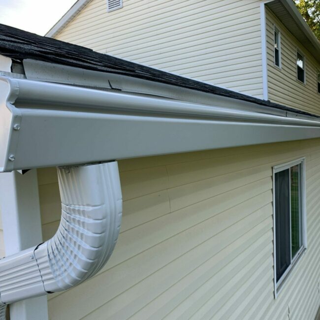 gutters on yellow house