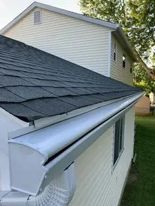 Close view of a K-Guard hooded gutter end and downspout elbow on a Central Ohio home