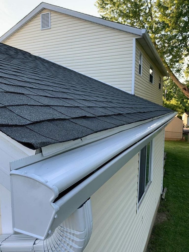 Close view of a K-Guard hooded gutter end and downspout elbow on a Central Ohio home